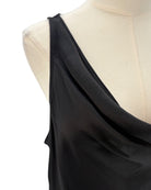Black one-shoulder top on a mannequin with a white background