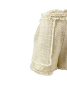 Cinq a Sept white shorts with textured tweed fabric on a white background