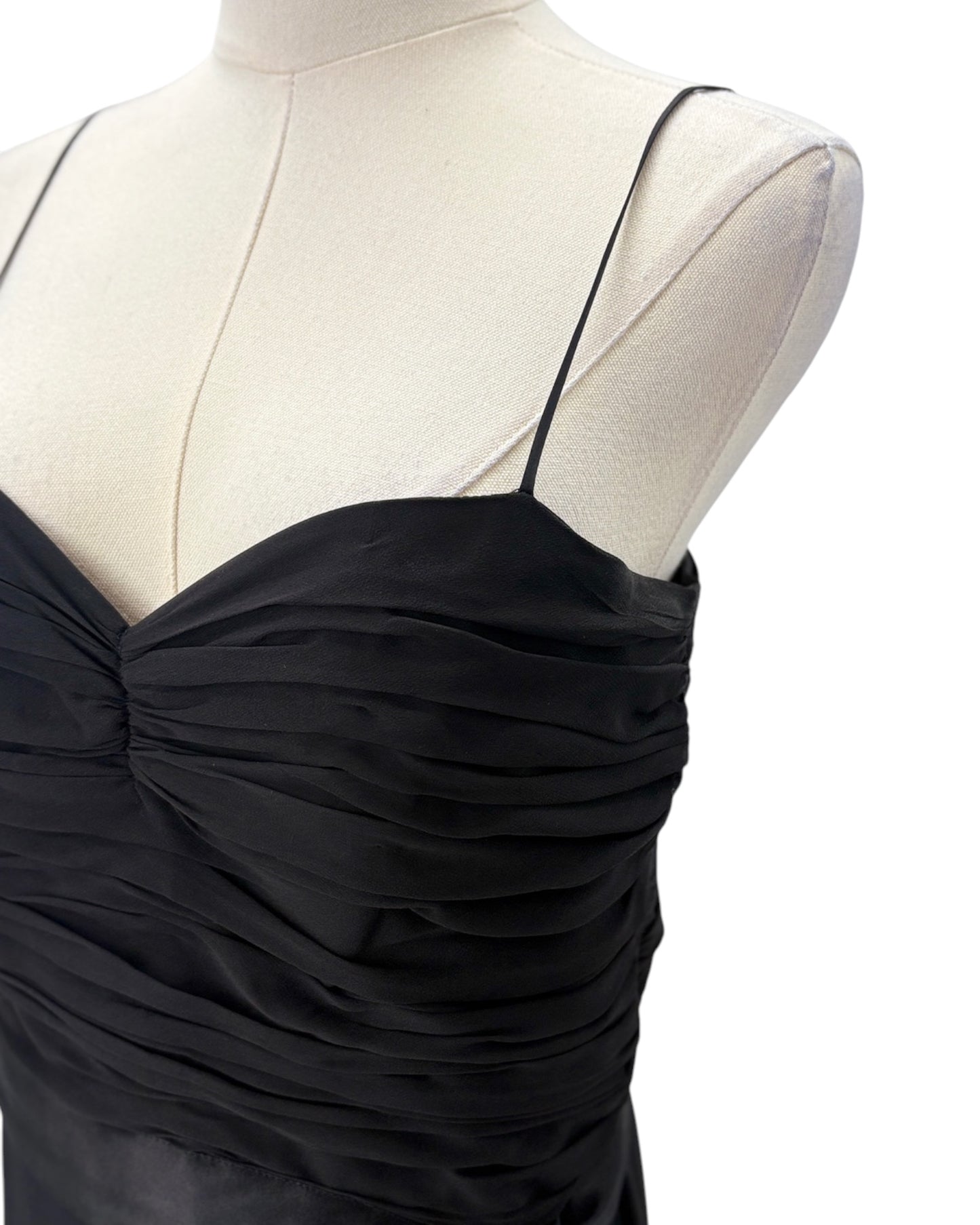 Black dress on a mannequin with a white background