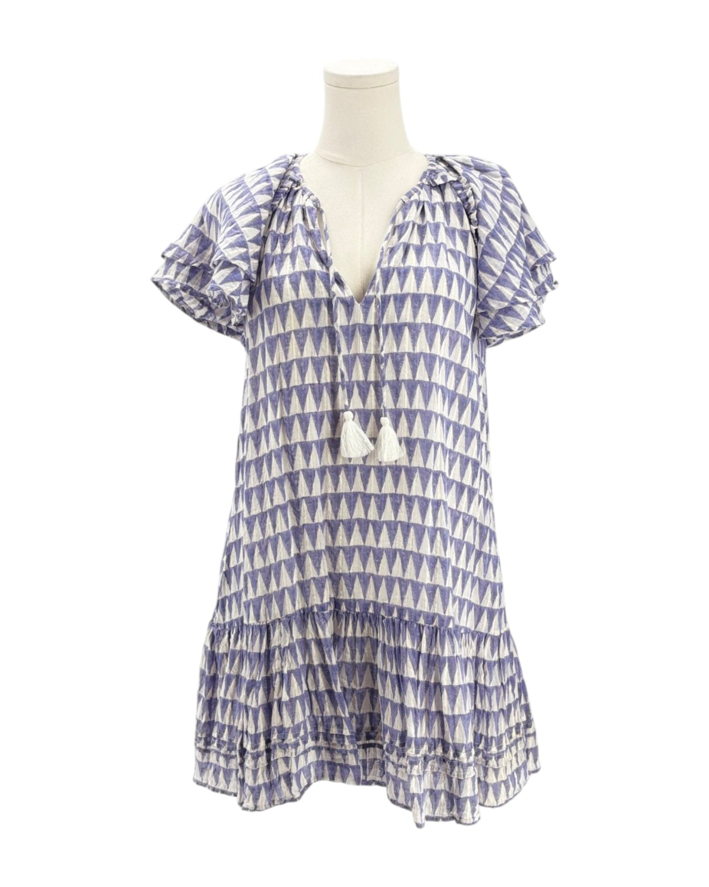 Blue and white patterned dress on a mannequin against a white background