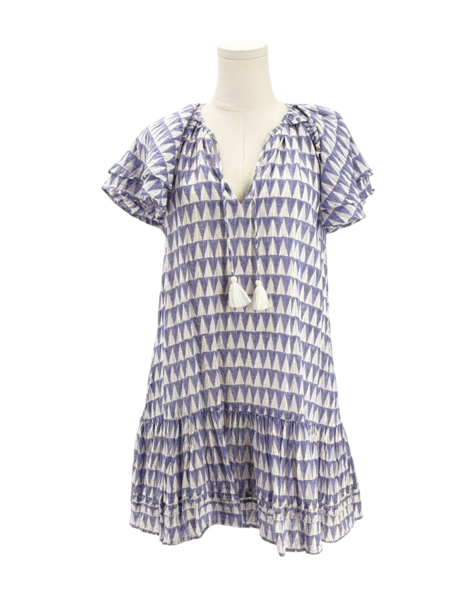 Blue and white patterned dress on a mannequin against a white background