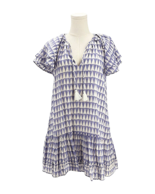 Blue and white patterned dress on a mannequin against a white background
