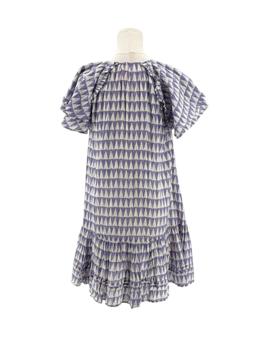 Blue and white patterned dress on a mannequin against a white background