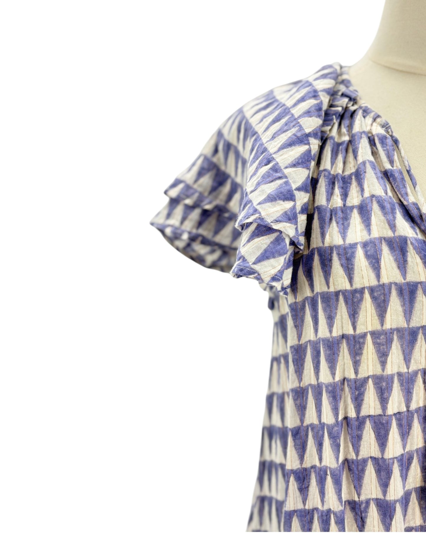 Blue and white patterned blouse on a mannequin against a white background