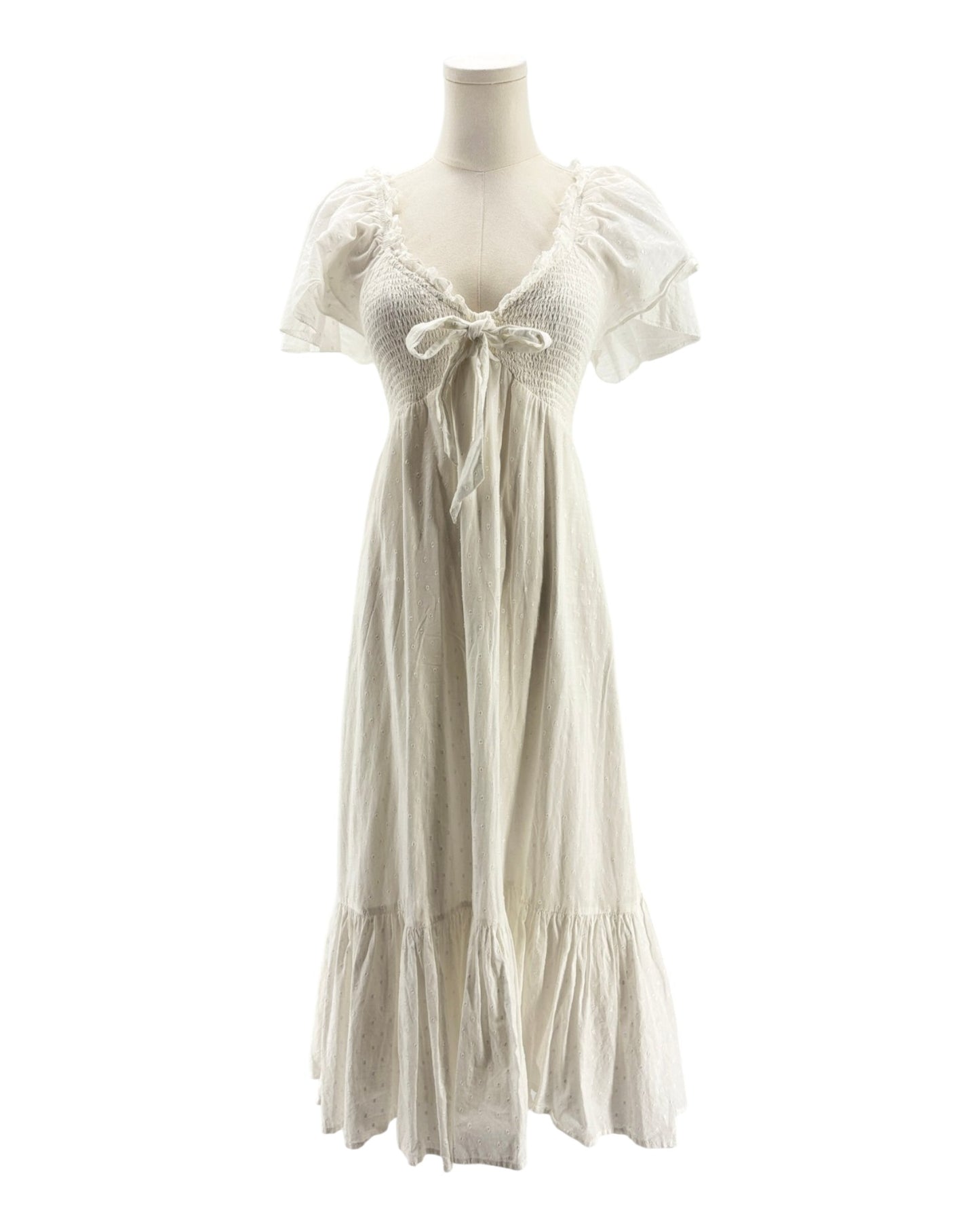 White dress on a mannequin against a white background