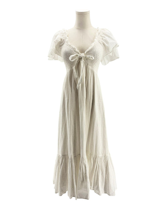 White dress on a mannequin against a white background