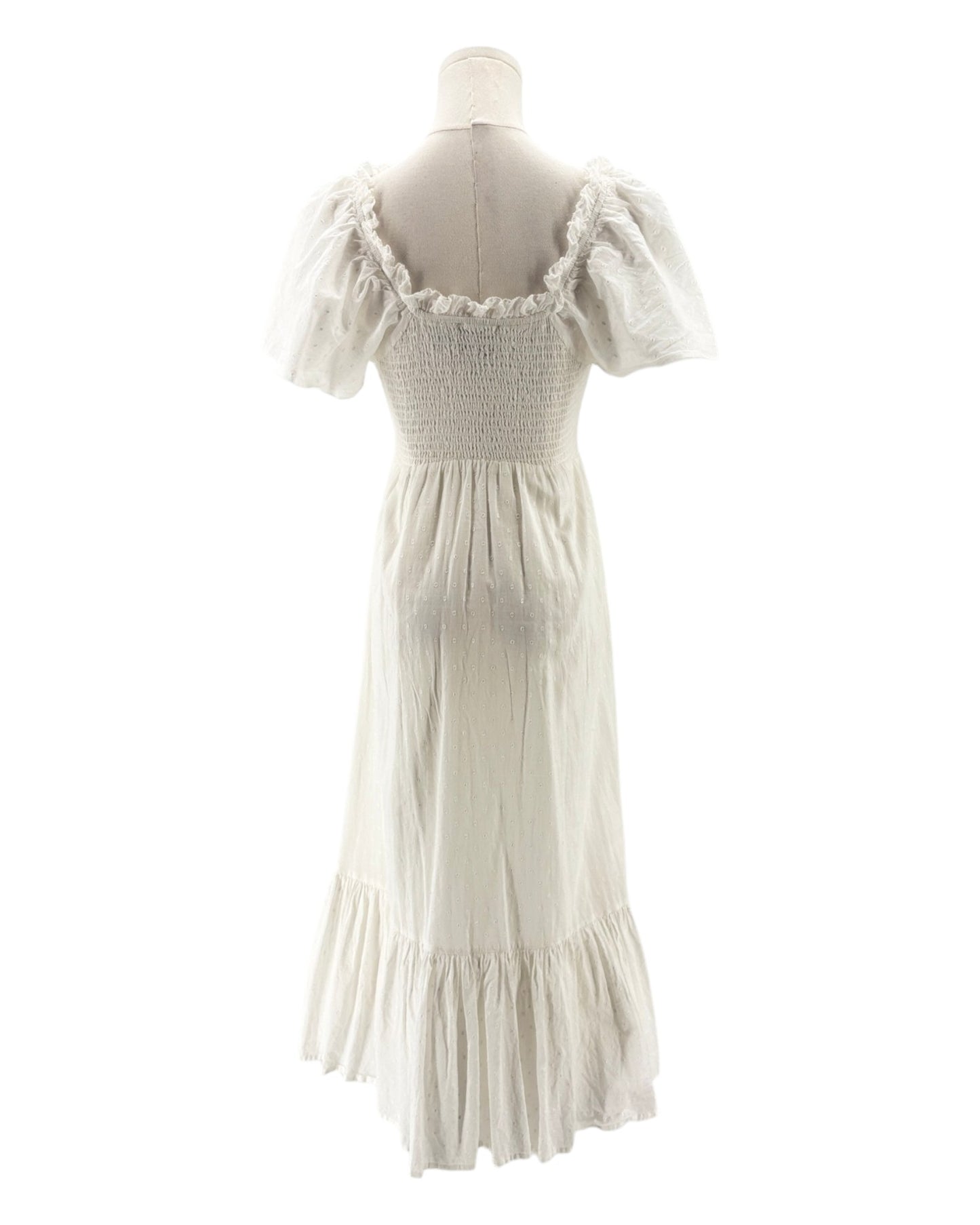 White dress on a mannequin against a white background