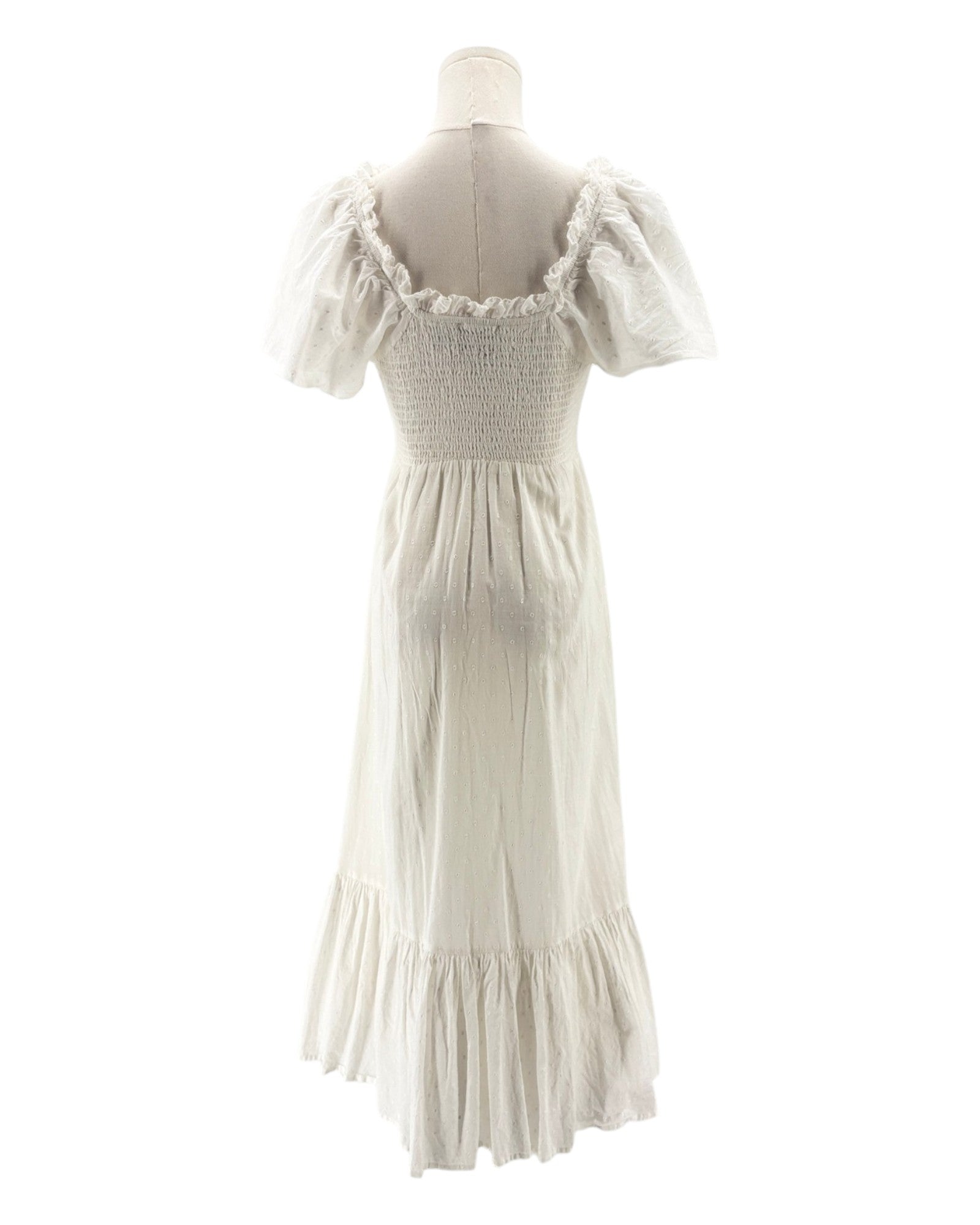 White dress on a mannequin against a white background