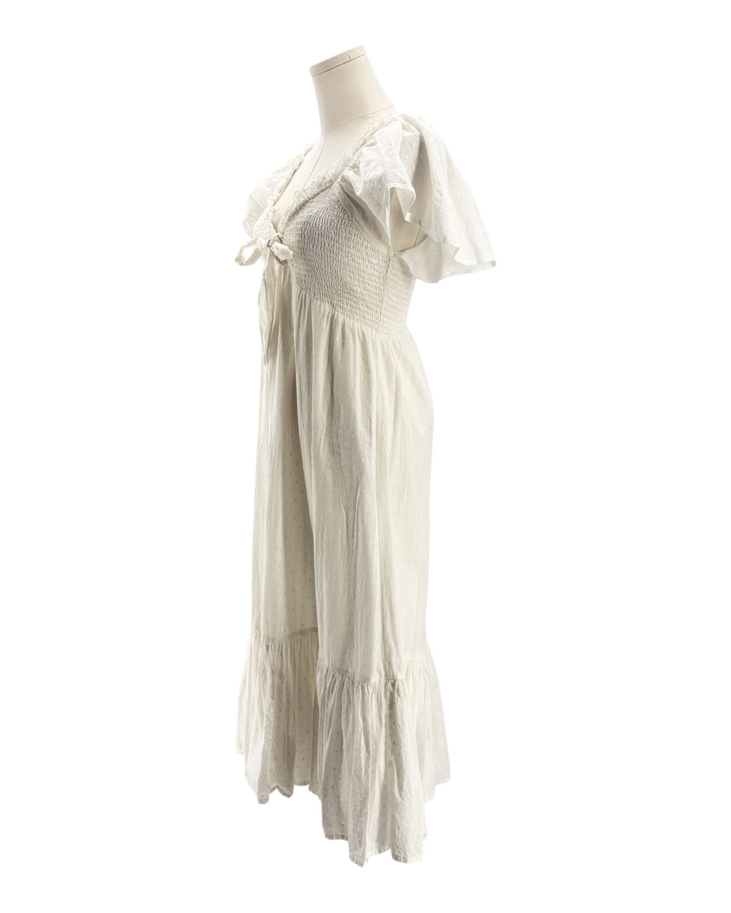 White dress on a mannequin against a white background