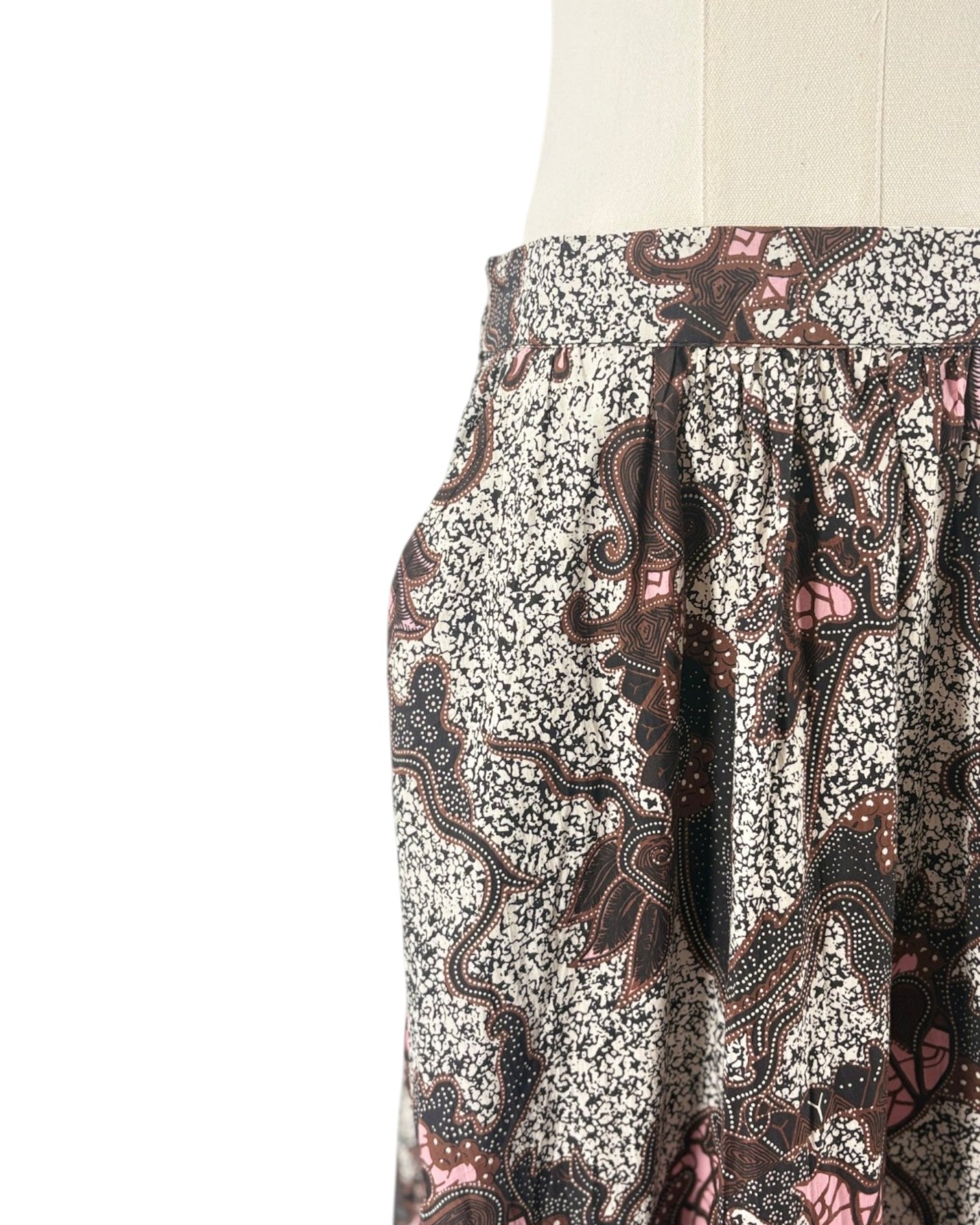 Patterned pants on a mannequin against a white background