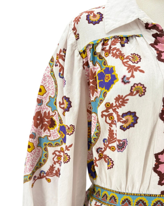 Colorful floral patterned garment on a white background