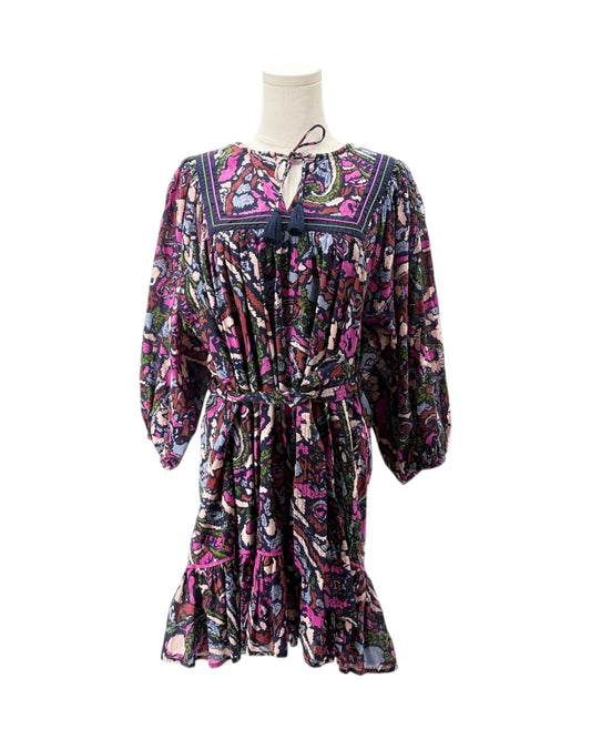 Multicolored patterned dress on a mannequin against a white background