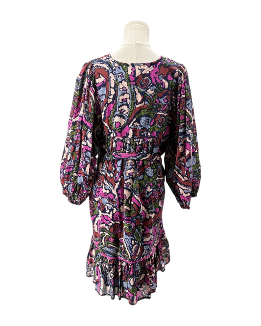 Colorful patterned dress on a mannequin against a white background