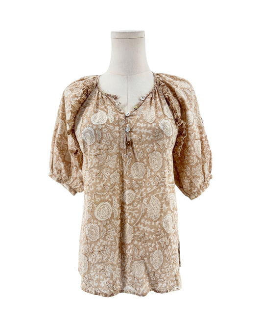 Tan and cream short sleeve floral print blouse on a mannequin on a white background