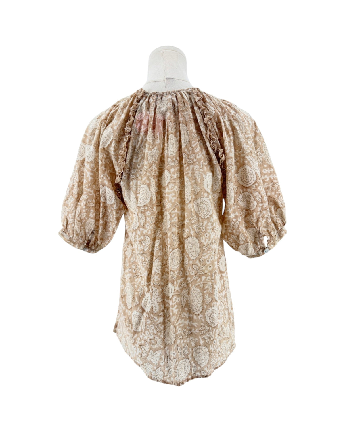 Tan and cream short sleeve floral print blouse on a mannequin on a white background