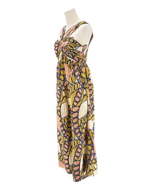 Colorful patterned dress on a mannequin against a white background