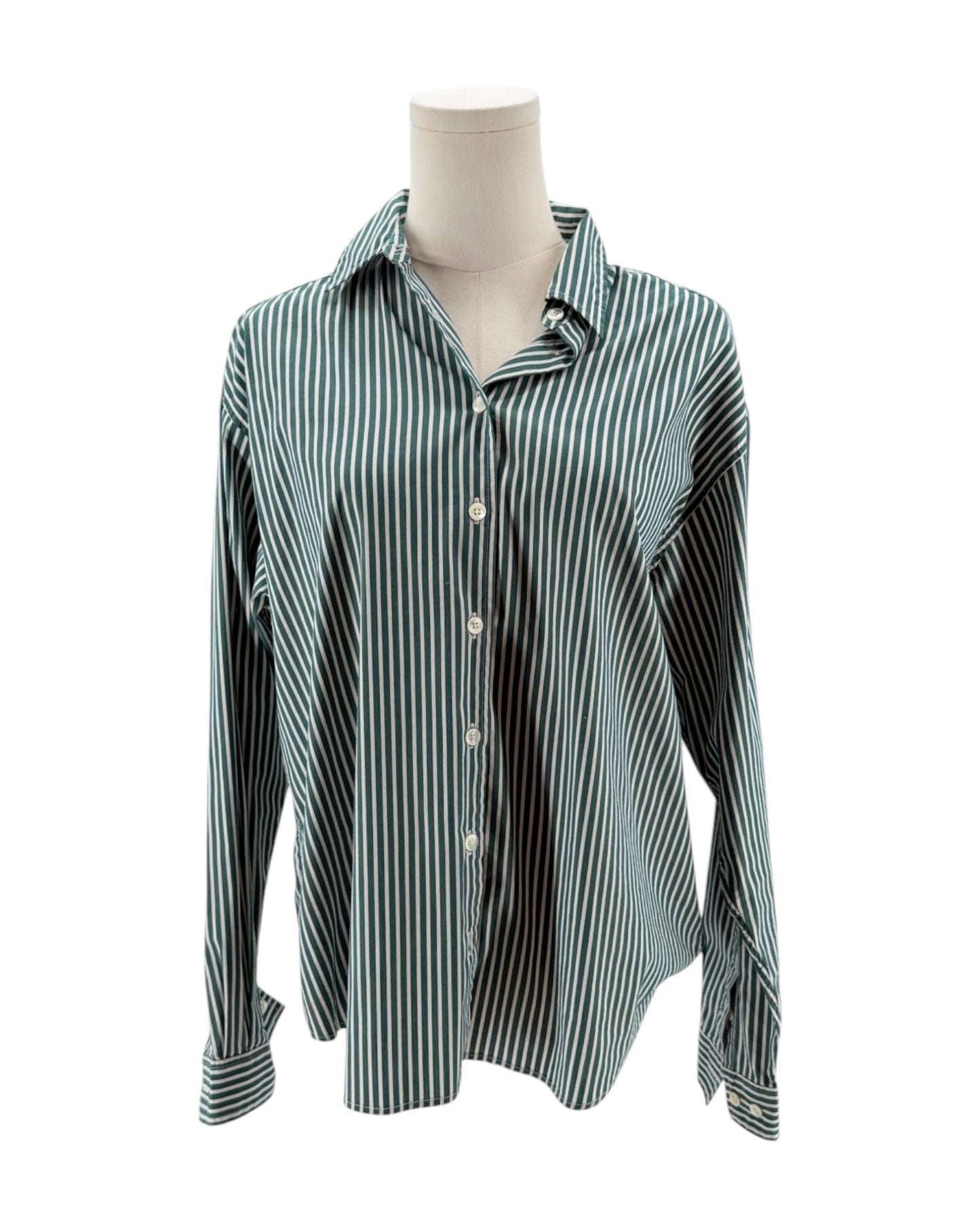Green and white striped shirt on a mannequin against a white background