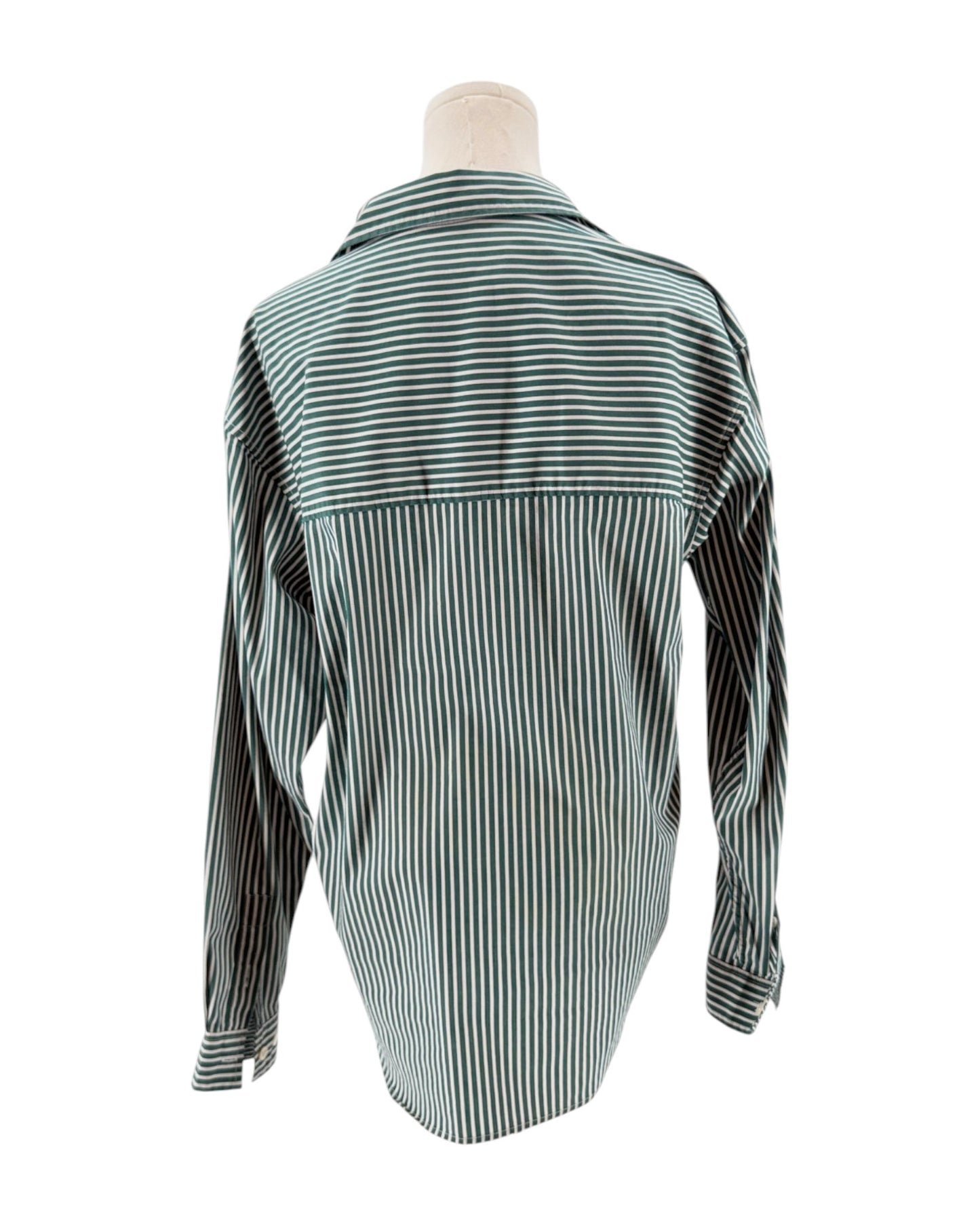 Green and white striped shirt on a mannequin against a white background