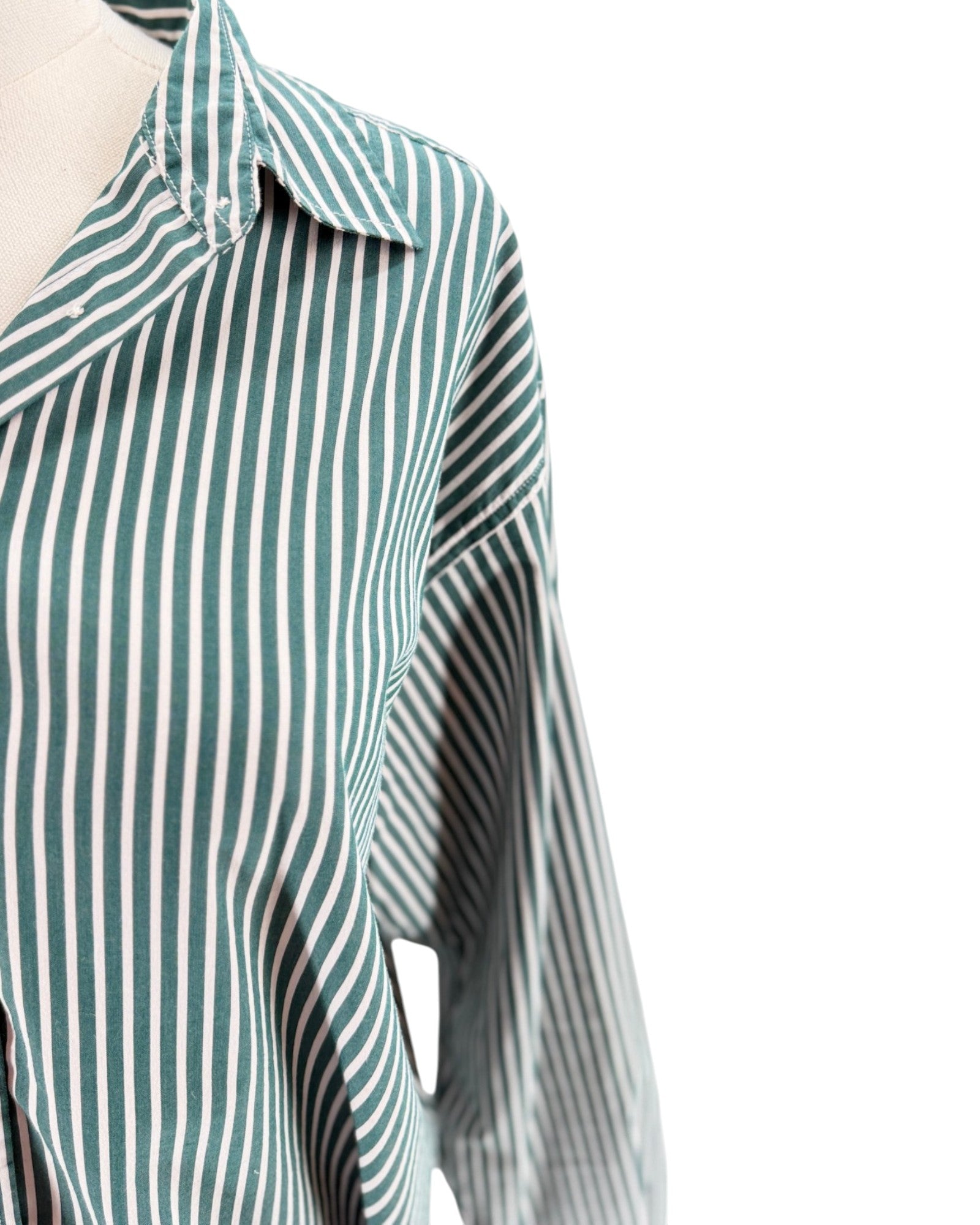 Green and white striped shirt on a white background