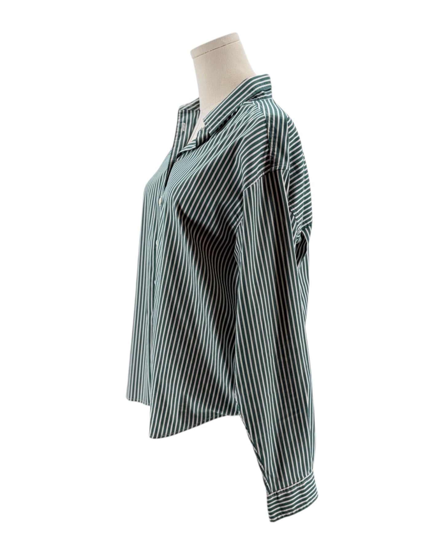 Striped shirt on a mannequin against a white background