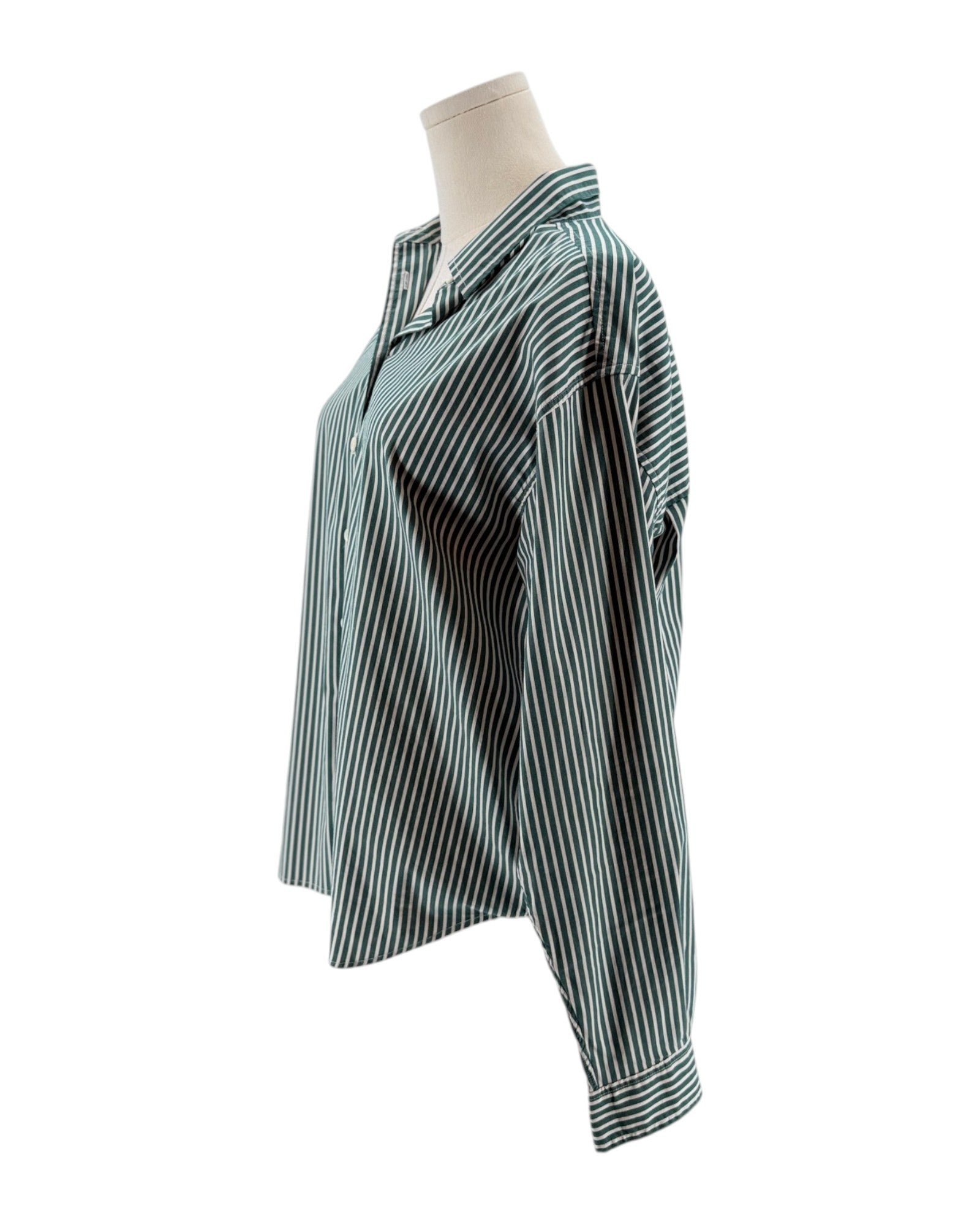 Striped shirt on a mannequin against a white background