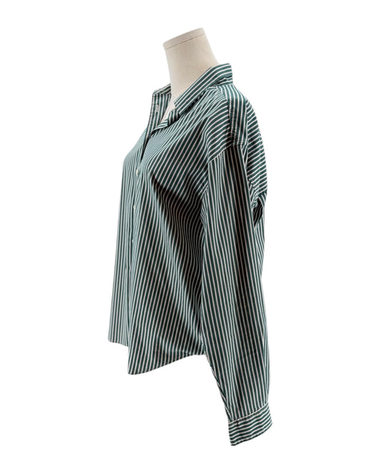 Striped shirt on a mannequin against a white background