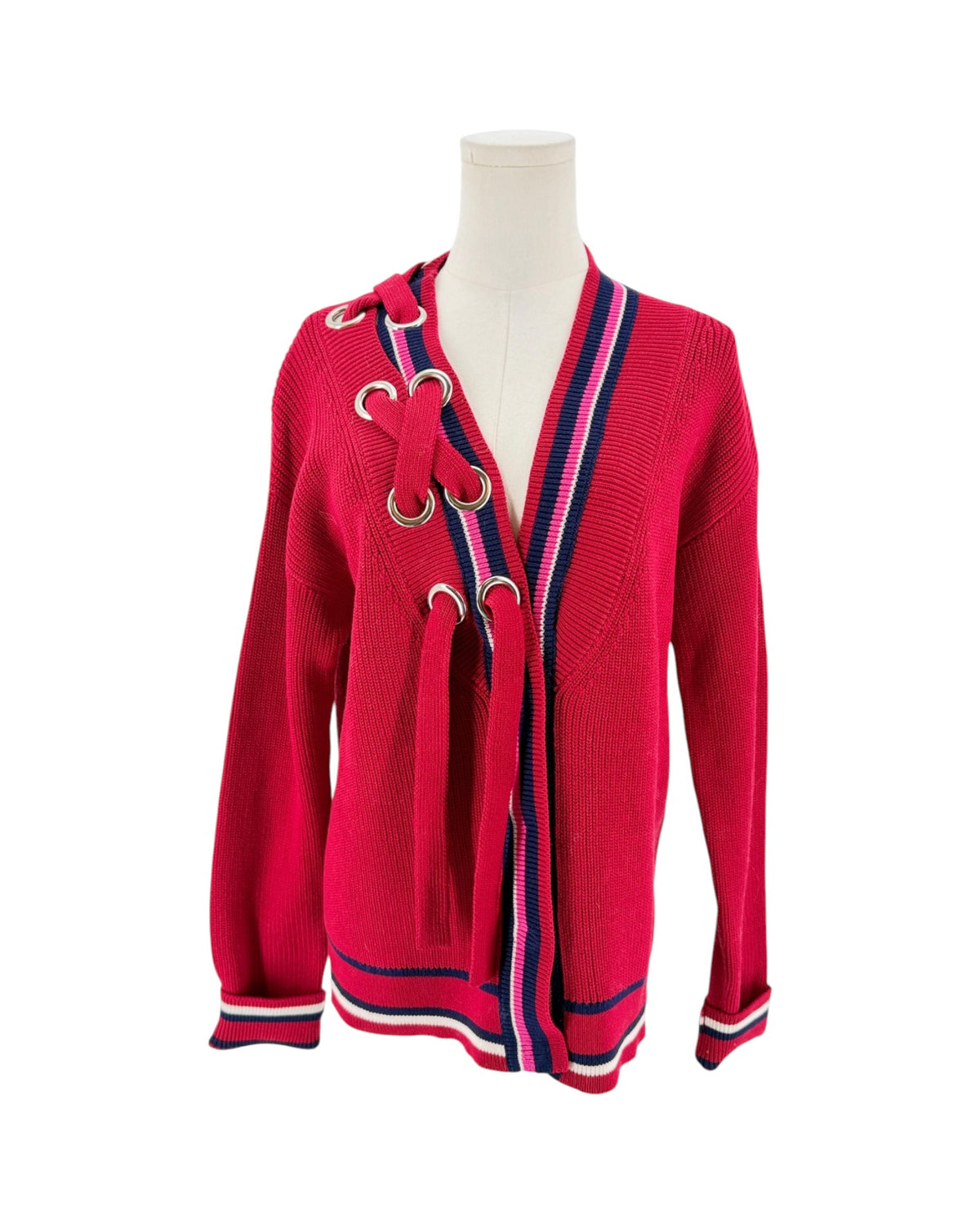 Color block cardigan with stripes and intricate detailing at the neckline. On a mannequin on a white background