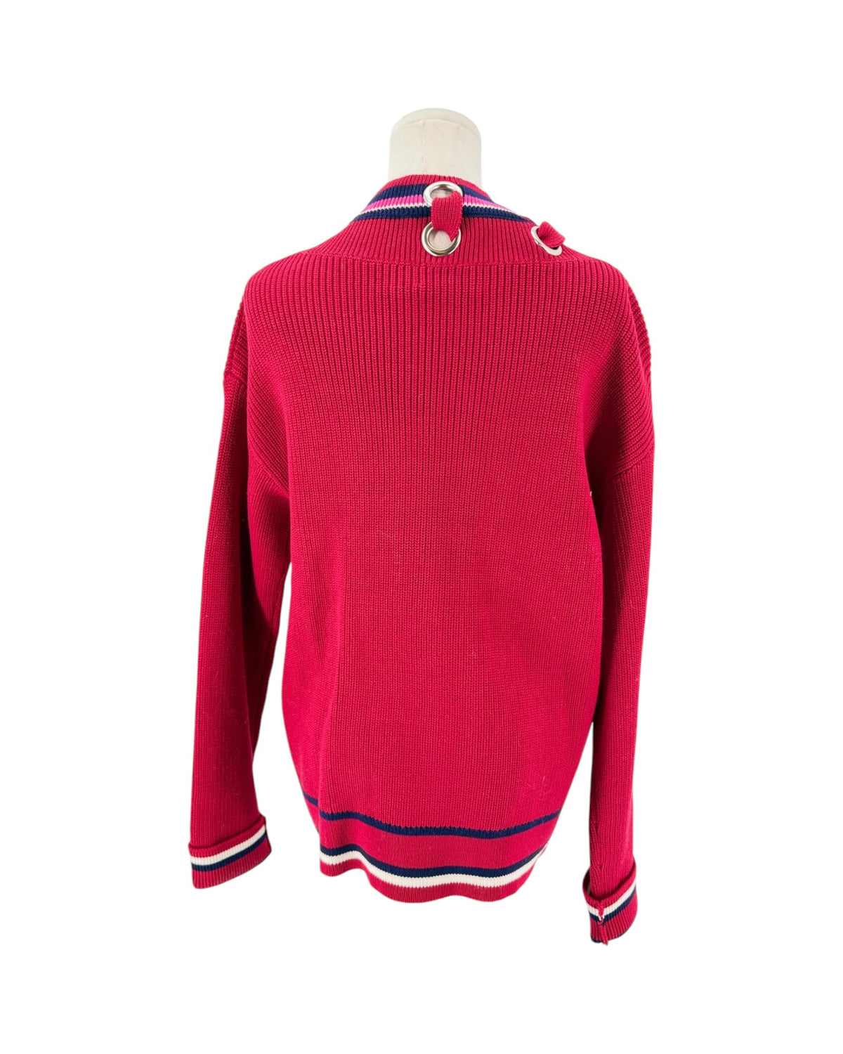 Color block cardigan with stripes and intricate detailing at the neckline. On a mannequin on a white background