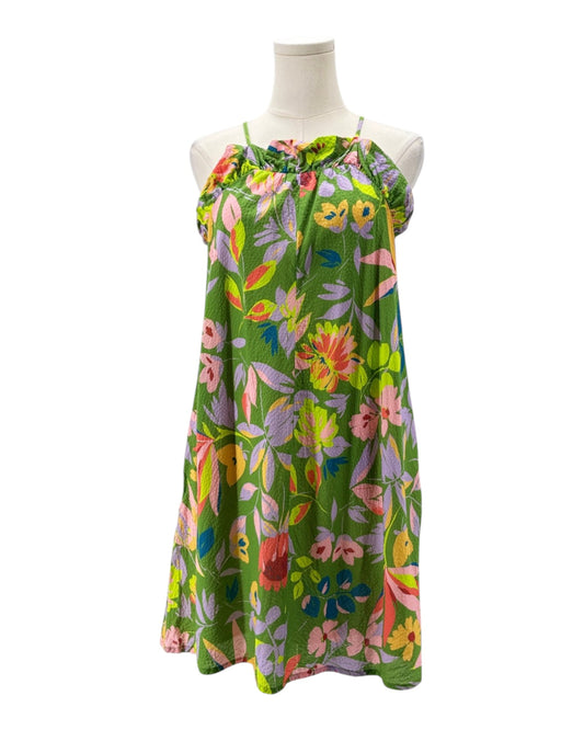 Colorful floral dress on a mannequin against a white background