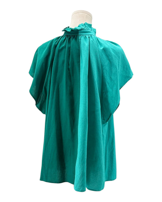Teal blouse on a mannequin against a white background