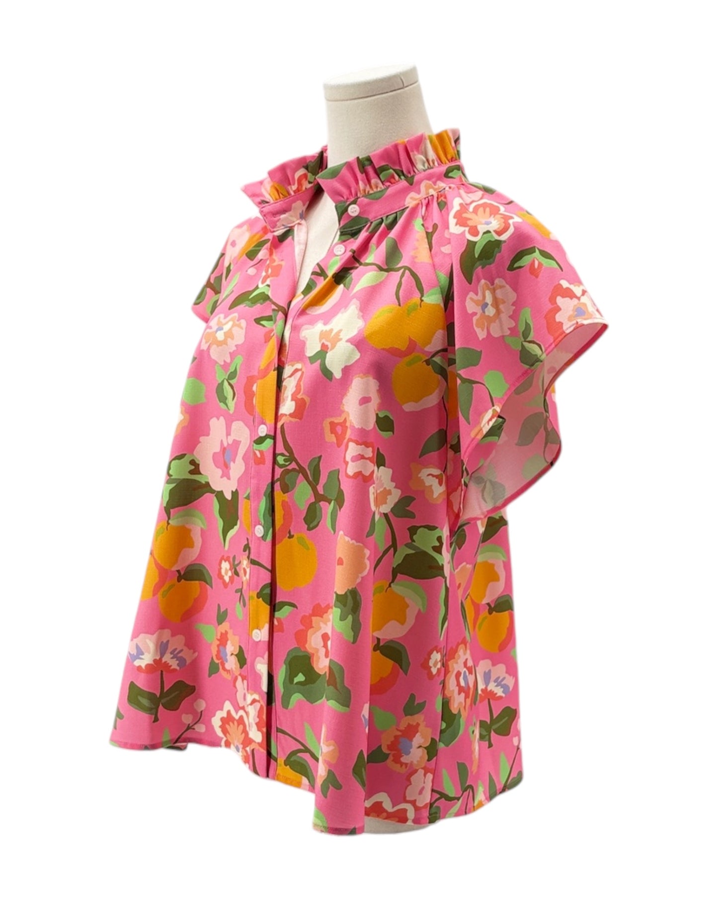 Pink floral blouse on a mannequin against a white background