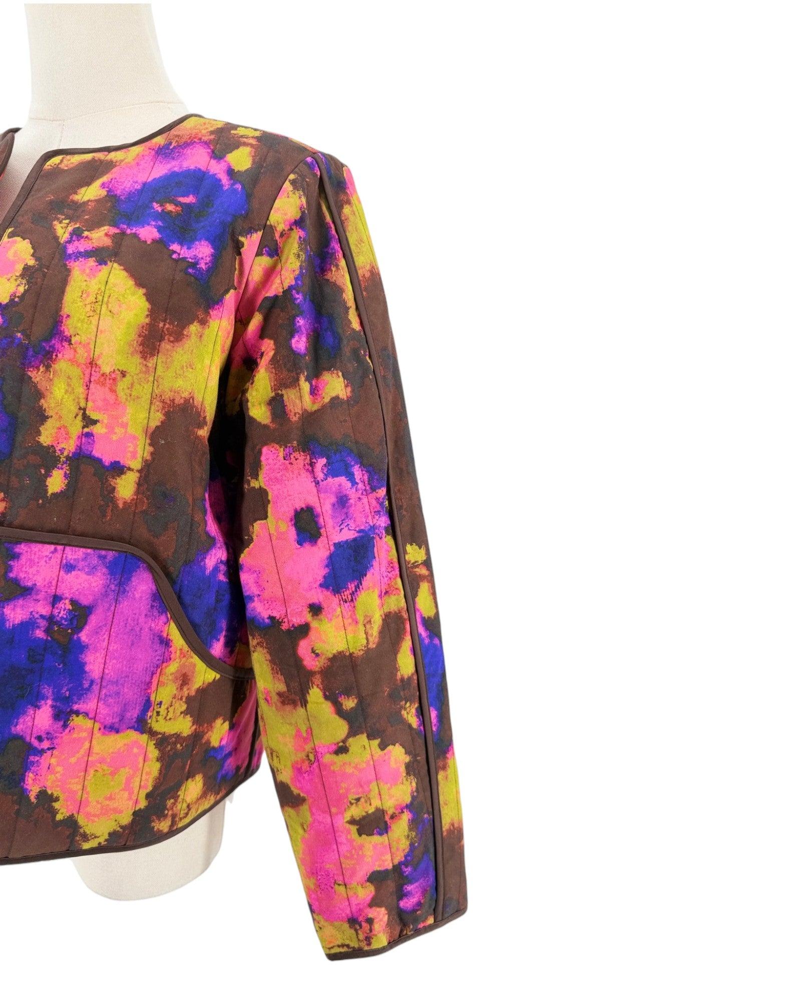 Abstract multi-color quilted long sleeve jacket on a white background