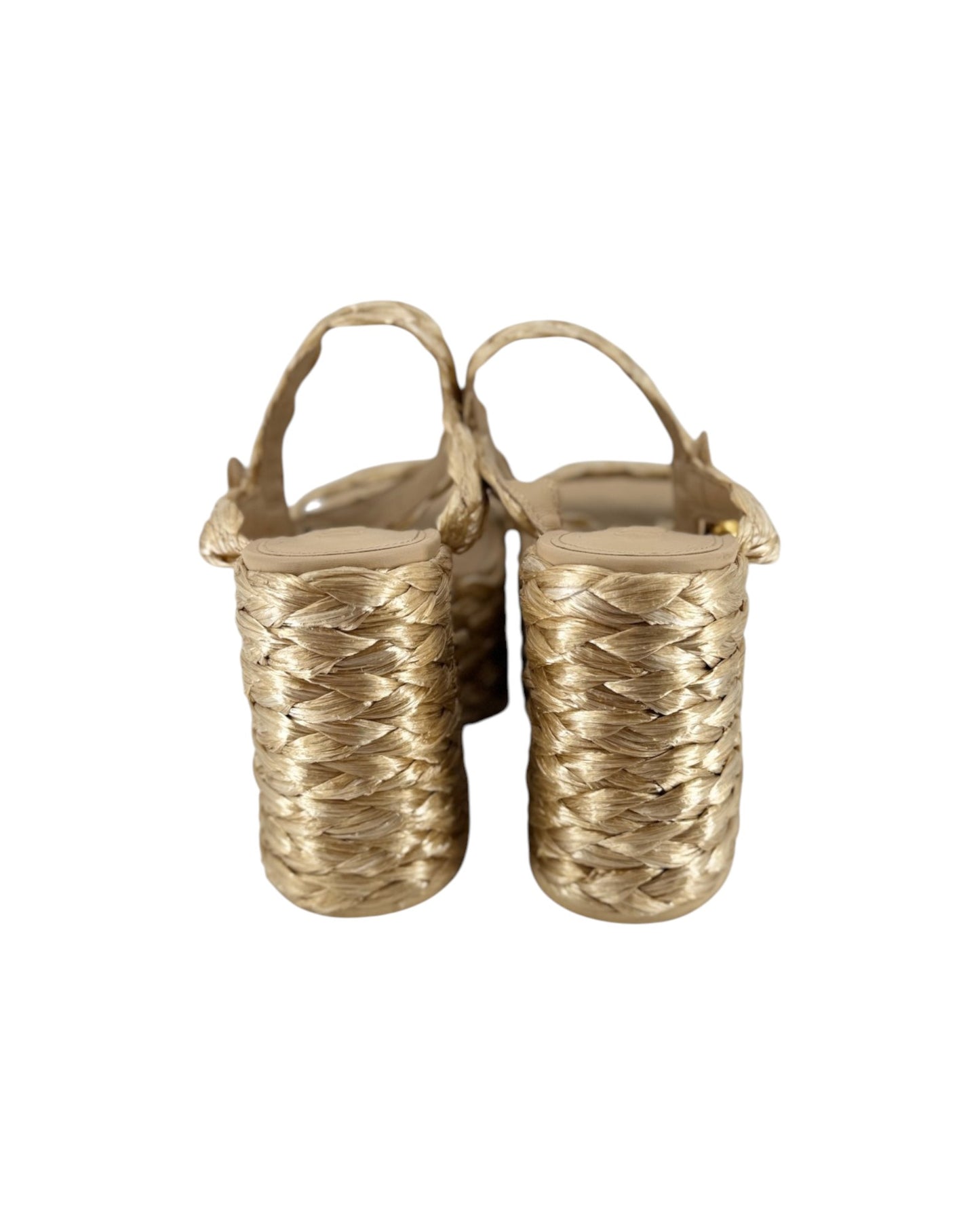 A pair of women's strappy sandals with chunky woven block heels in a metallic gold finish, shown from a rear three-quarter view on a white background.