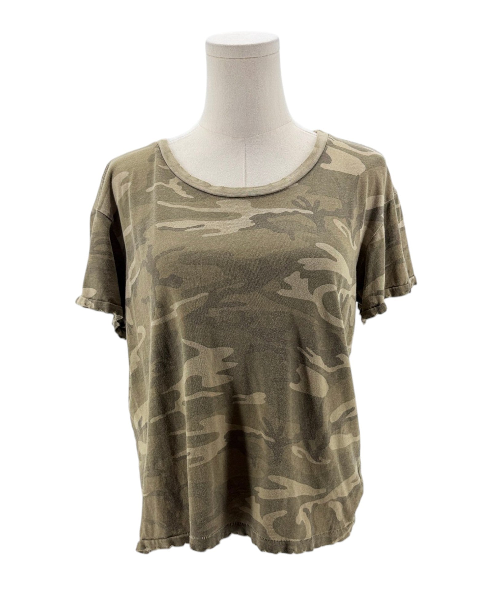 Camouflage t-shirt on a mannequin against a white background