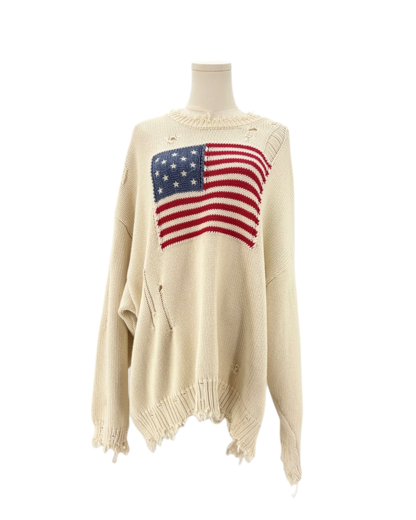 Denimist beige sweater with an American flag design on a mannequin against a background