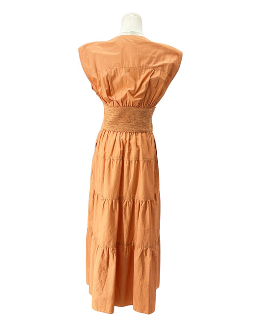 Orange dress on a mannequin against a white background