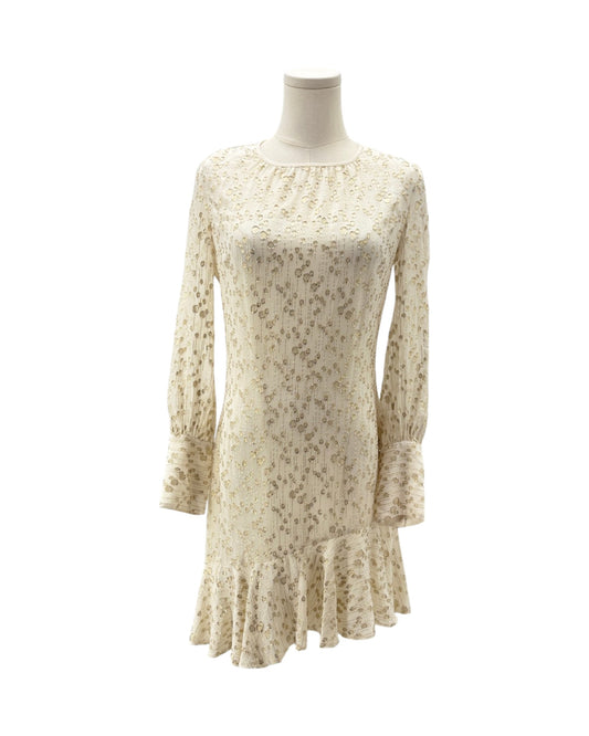 Beige floral dress on a mannequin against a white background
