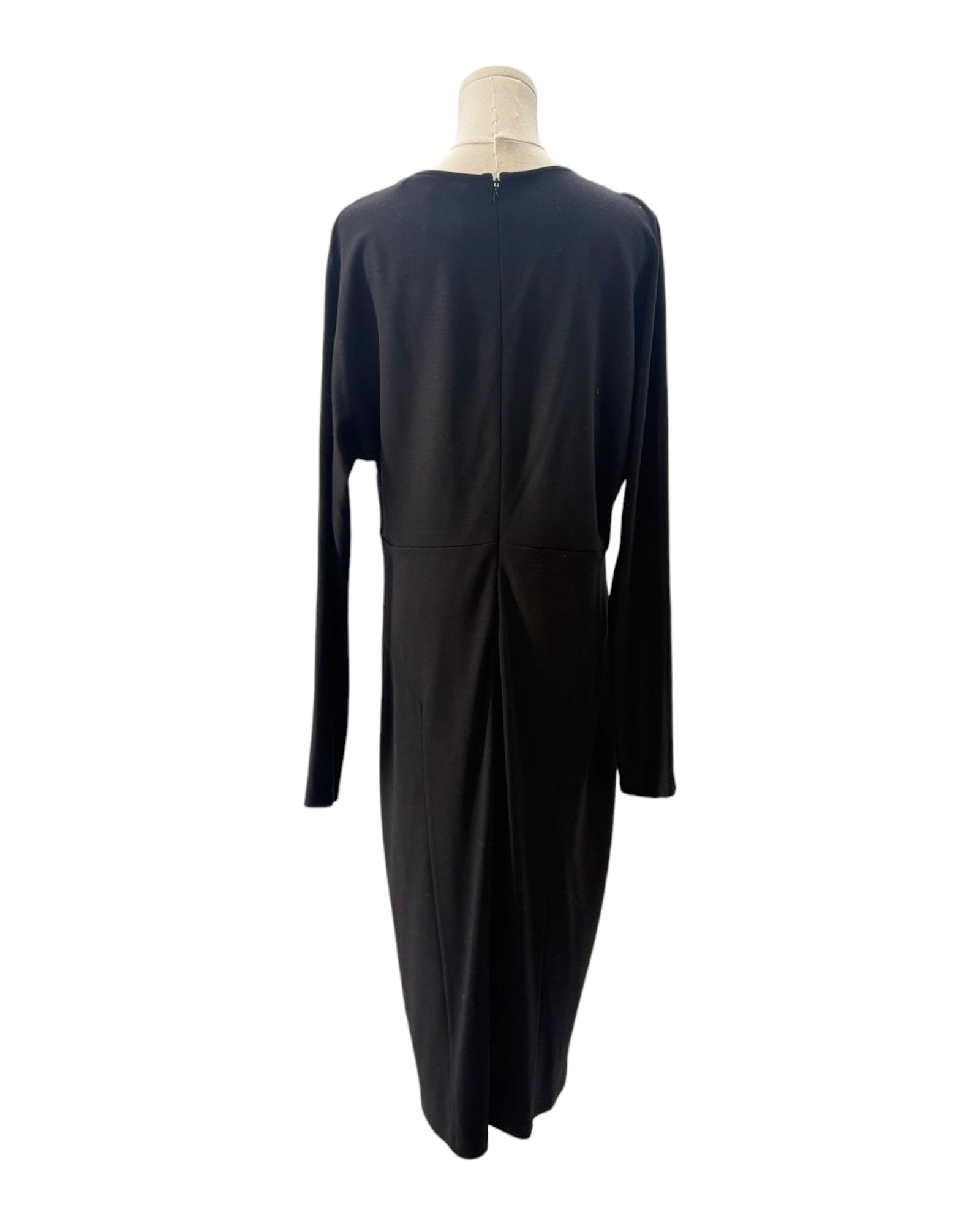 Black dress on a mannequin against a white background