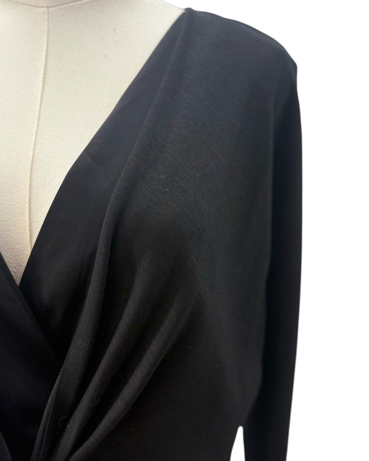 Black dress on a mannequin with a white background