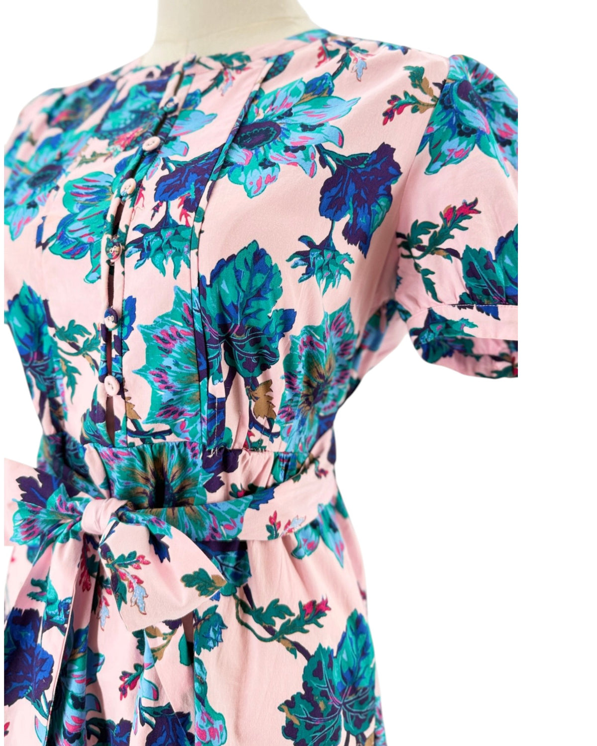 Short sleeve floral maxi dress with a tie waist on a mannequin on a white background