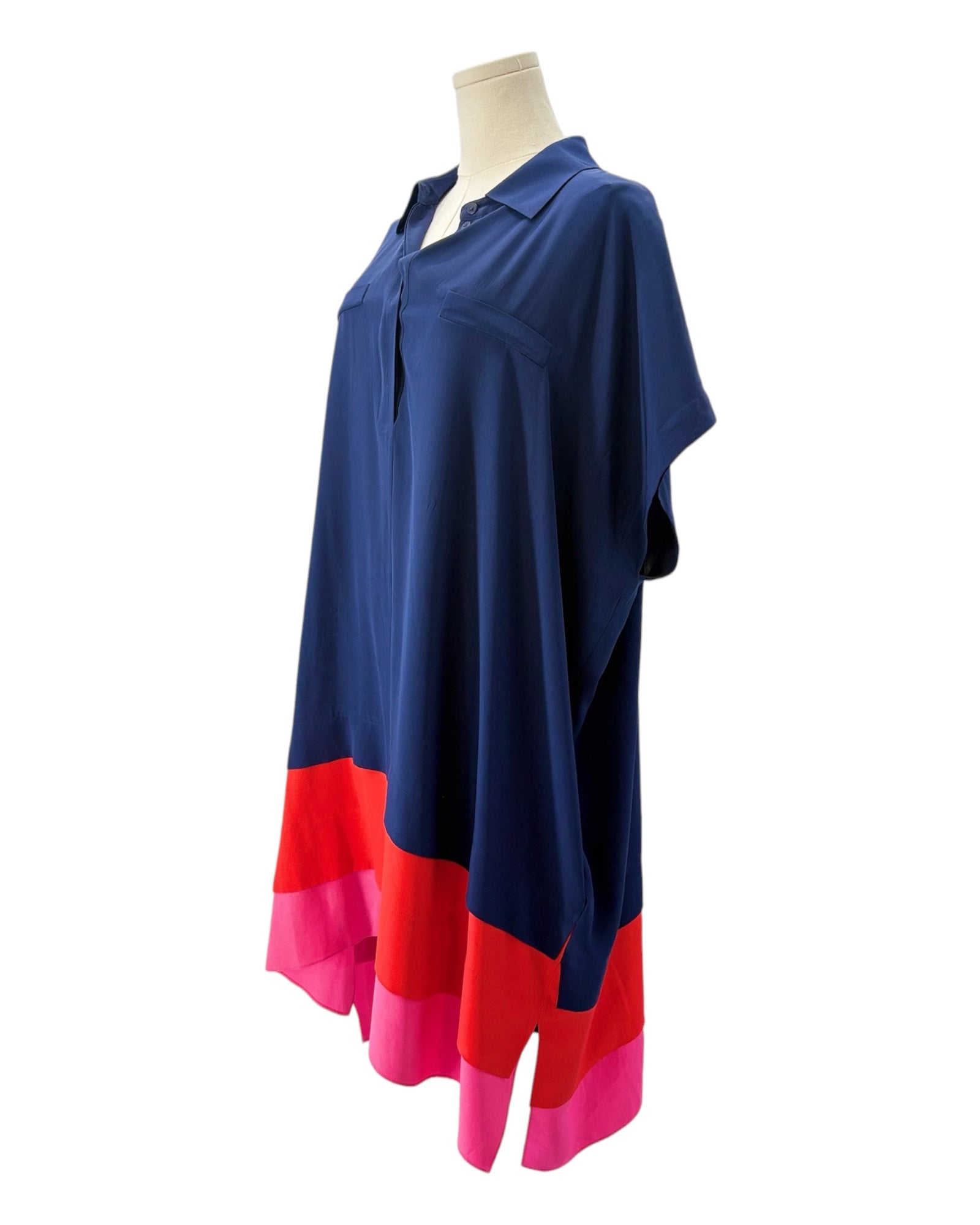 Navy and pink dress on a mannequin against a white background