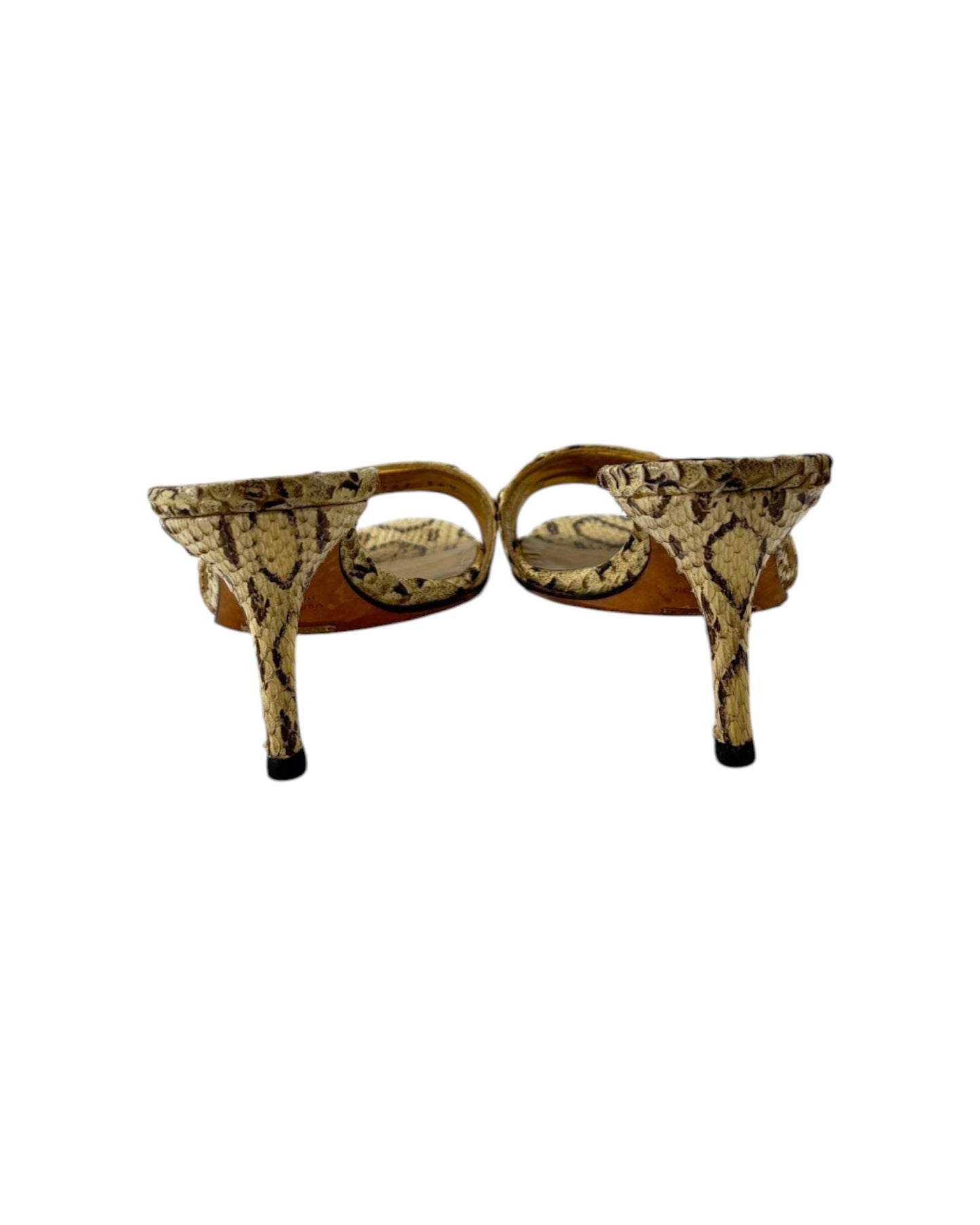 Gold high-heeled shoes with snake print pattern on a white background