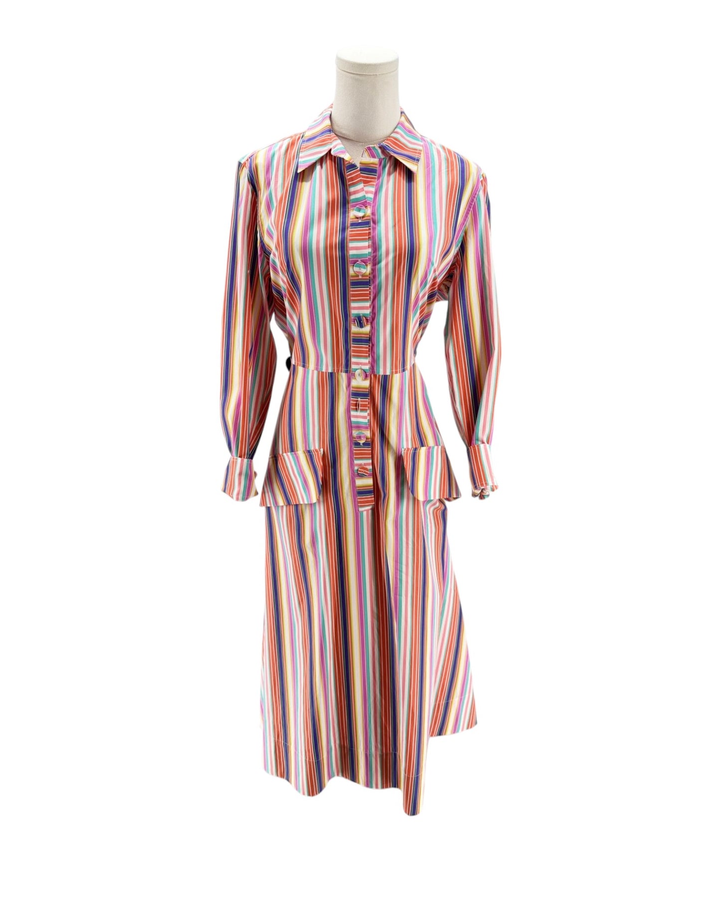 Multicolored striped dress on a mannequin against a white background