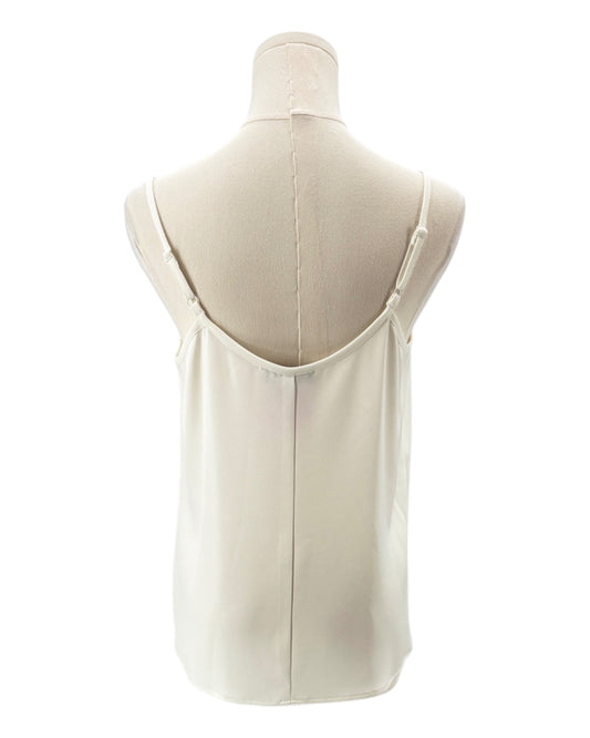 White sleeveless top on a mannequin against a white background
