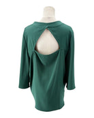 Green long-sleeve top on a mannequin with a white background