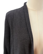 Black textured blazer on a mannequin against a white background