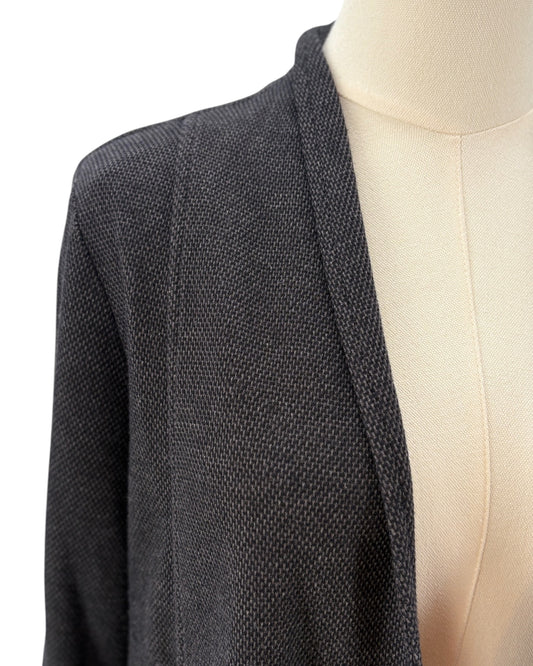 Black textured blazer on a mannequin against a white background