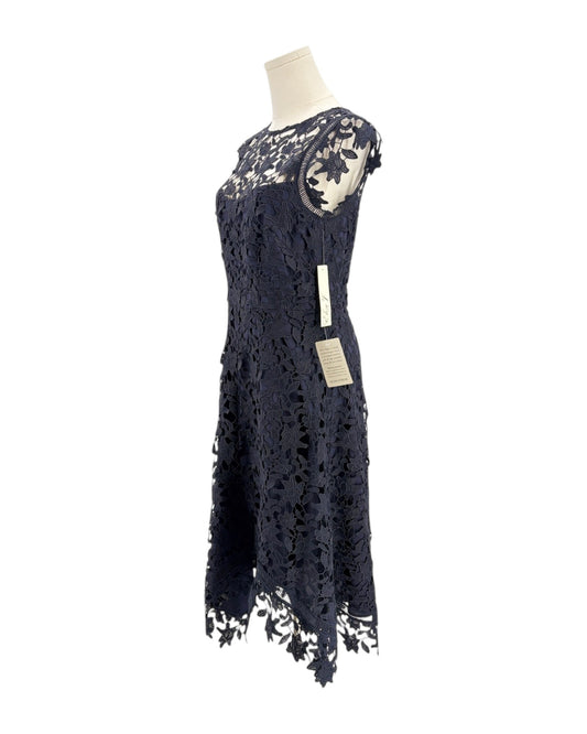 Navy lace dress on a mannequin with a white background