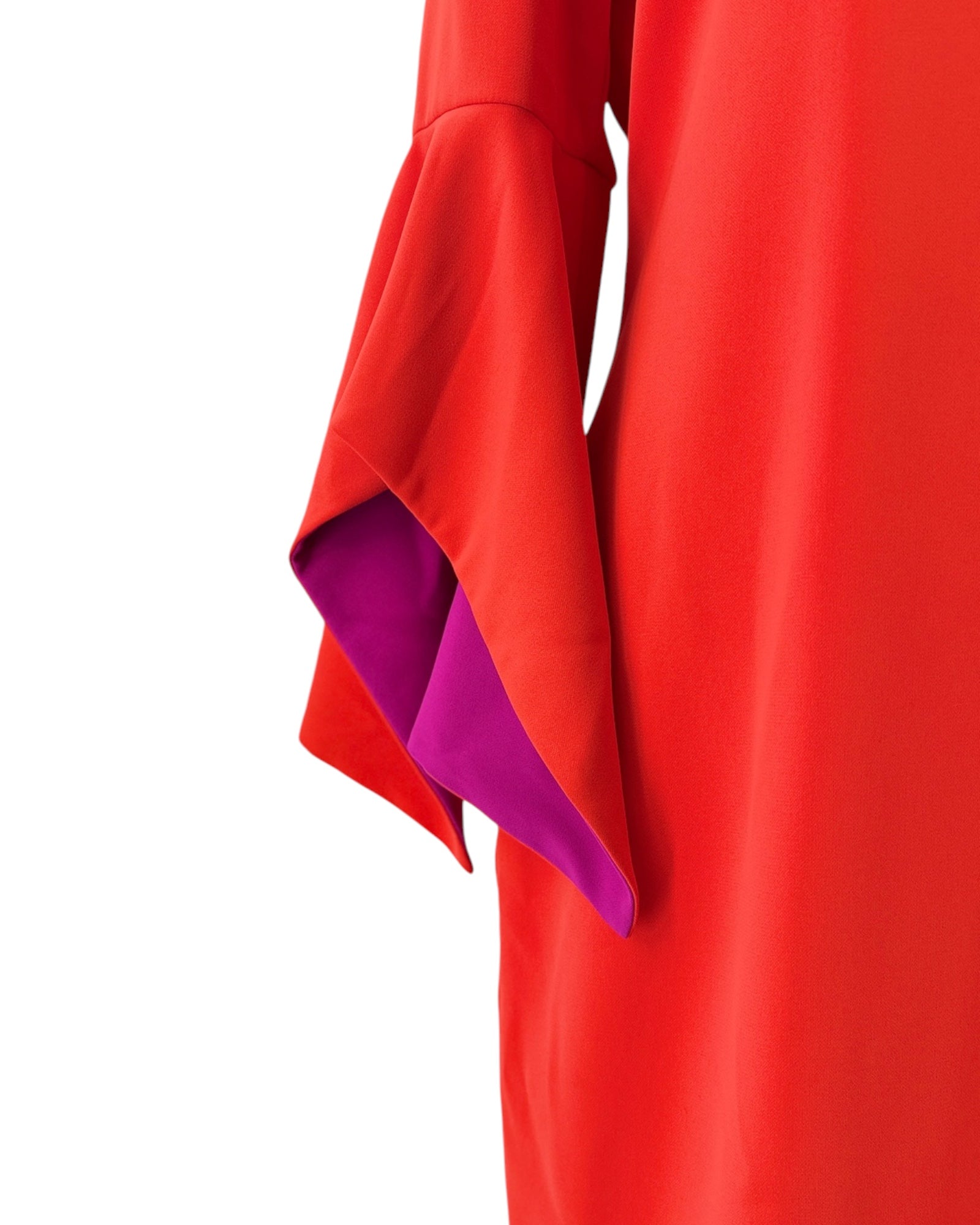 Close-up of a red garment with a purple lining on a white background