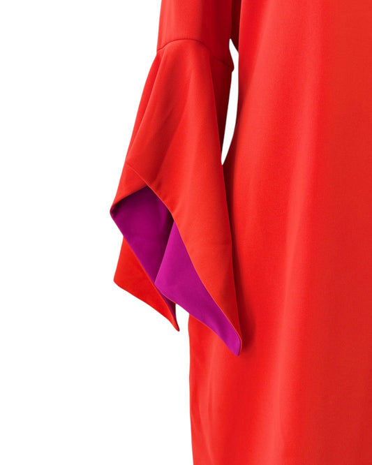 Close-up of a red garment with a purple lining on a white background